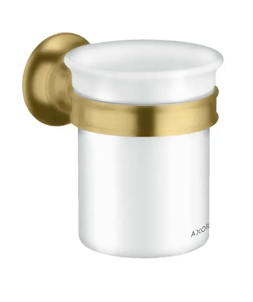 Zahnputzbecher aus Glas mit einem goldfarbenen Metallring und Wandhalterung, hergestellt von AXOR.